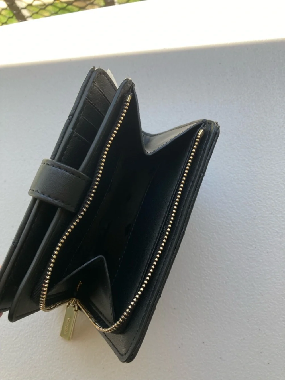 Kate Spade New York Carey Medium Compact Bifold Wallet in Black Quilted Leather